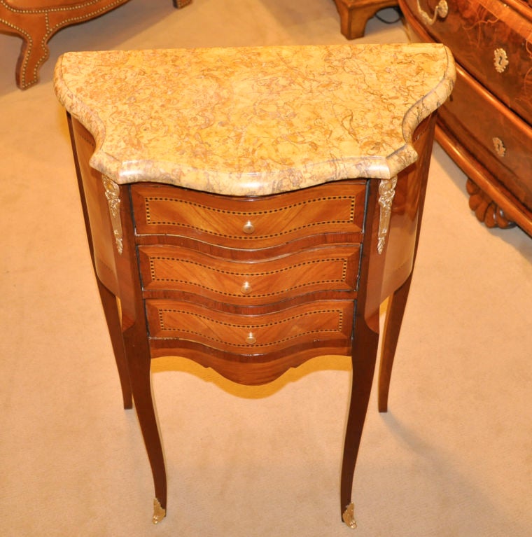 Pair of French Transitional Style Fruitwood and Mahogany Chests with marble tops.