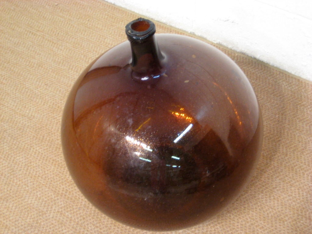 French hand blown amber glass demijohn bottle<br />
<br />
MORE ANTIQUES AVAILABLE AT WWW.OFLEURY.COM