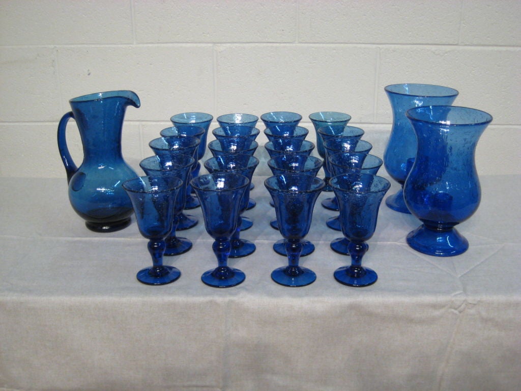 A nice set of 20 glasses, on pitcher and two hurricanes - candels globes. All signed Biot. This factory capture the technique of hand blowing glass and incorporating air bubbles into it.<br />
<br />
MORE ANTIQUES AVAILABLE AT WWW.OFLEURY.COM