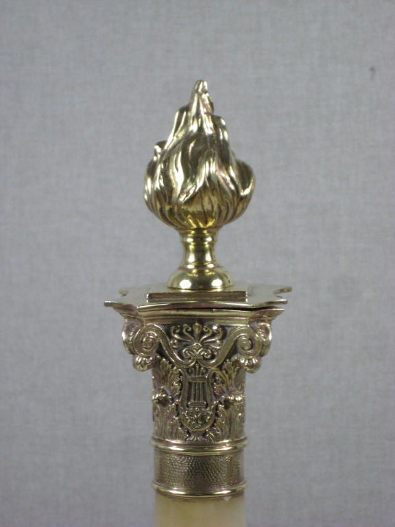 A Pair of Brass and Iron Continental Chenets or Andirons
