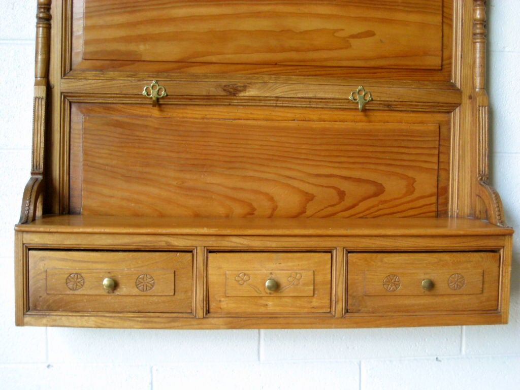 Made of elm wood with three drawers, this shelf is a great addition to your kitchen or entryway. Brass hooks replaced.<br />
<br />
MORE ANTIQUES AVAILABLE AT WWW.OFLEURY.COM