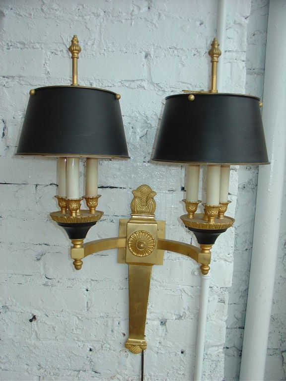 A French empire gilt bronze  two-arm sconce with metal shades.