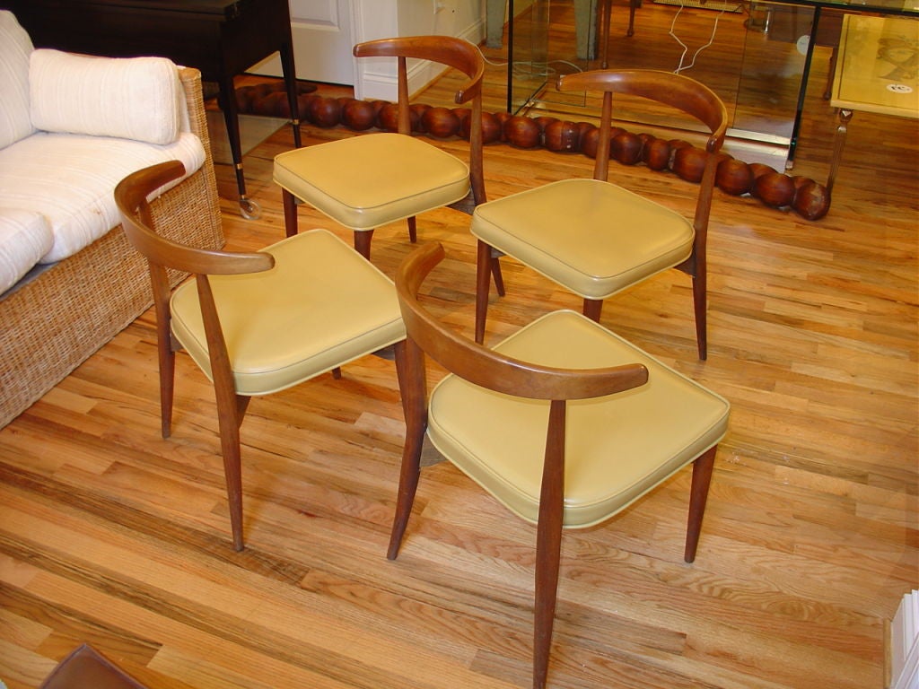 A set of four Danish style dining chairs in original upholstery.