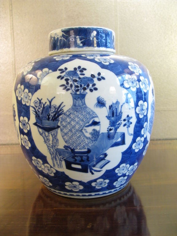 Beautiful Chinese 19th century ginger jar with lid.<br />
<br />
Brilliant cobalt blue color.<br />
<br />
Reserves of design with flowers in vases, with background of prunus blossoms and branches.