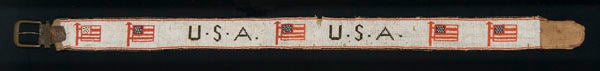 Turn-of the century, beaded, Native American belt with flag images.<br />
<br />
Mounting: The textile has been hand-stitched to 100% cotton, black in color, that has been washed to reduce excess dye. An acid-free agent was added to the was to