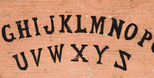 Hand-made Ouija board. Last quarter 19th Cent. -1910. The background is salmon pink and the lettering is black, hand-painted on a pine plank. This is the earliest American example that I have ever seen; wonderfully simplistic and with great, early