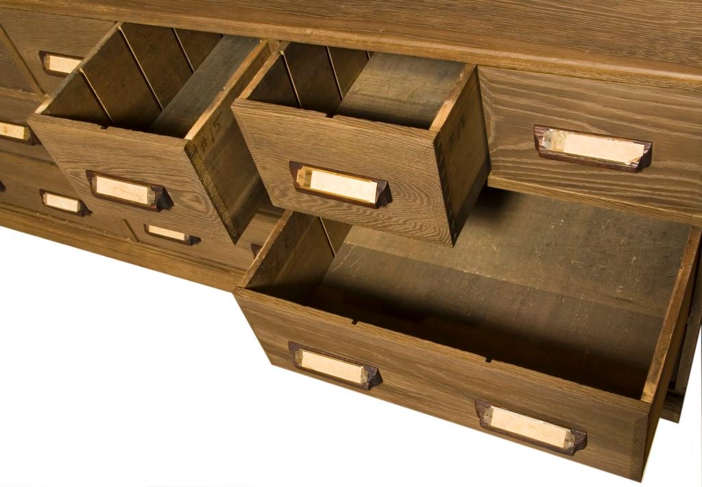 Wonderful large vintage hardware store cabinet. The inside of the drawers still have the original items listed.