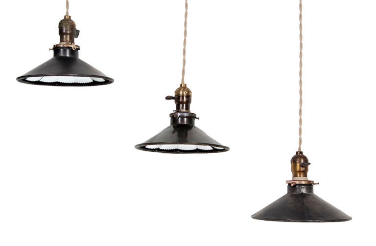 Elegant industrial pendant lights with a mirrored paneled interior. Priced individually. Height includes cord. Shade height is 3