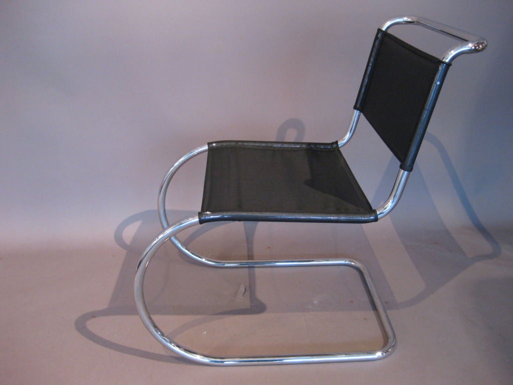 Pair of tubular chrome MR side chairs designed by Mies van der Rohe for Thonet. This pair of chairs are c.1960 with Eisengarn mesh upholstery and Thonet West Germany labels. Seat height: 16.75