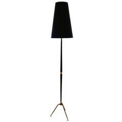 A Floor Lamp in Mahogany and Brass in the style of Ico Parisi