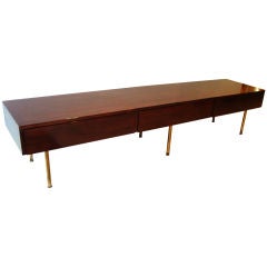 A Long Low Three Drawer Console in Walnut by Alfred Hendrickx