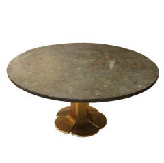 A Round Cocktail Table in Bronze and Cast Fossil Stone