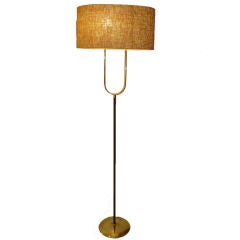 A Modernist Two Light Floor Lamp in Wood and Brass