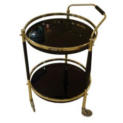A Round Modernist Bar Cart in Brass, Lacquer and Black Glass