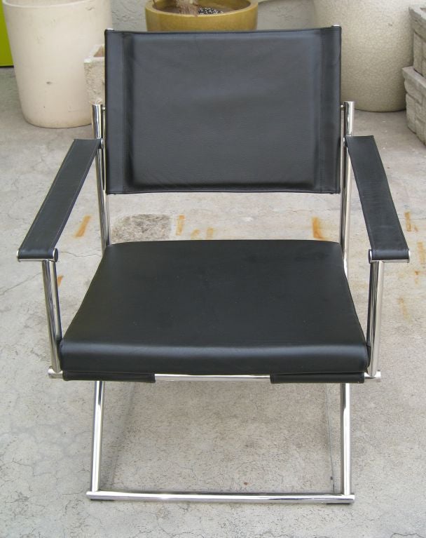 Pair of Mark Singer Folding Campaign Chairs.  Chrome, Leather and Steel Airplane Cable.