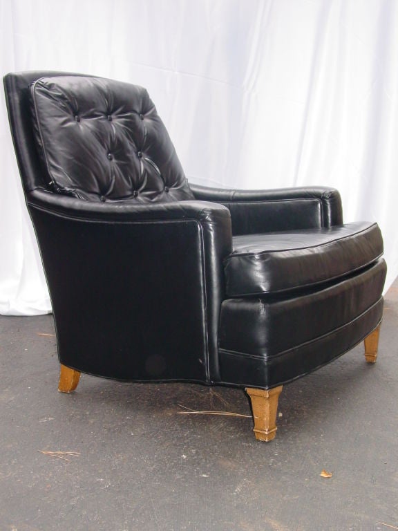 Completely original black leather lounge chair by Heritage Furniture Company in pristine original condition.  Semi-attached back cushion with button tufting, and loose T-shape seat cushion.  I suspect this was made soon after Heritage merged with