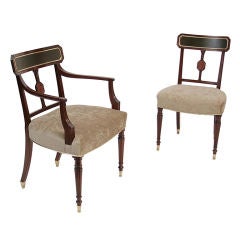 A set of 14 Sheraton mahogany dining chairs.