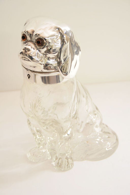 An unusual Austrian silver plate mounted glass decanter, in the form of a seated King Charles Cavalier spaniel.