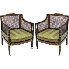 An associated pair of Regency bergeres.