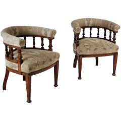 Antique A set of four mahogany upholstered pub chairs.