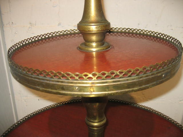 Tiered table with brass gallery.
 