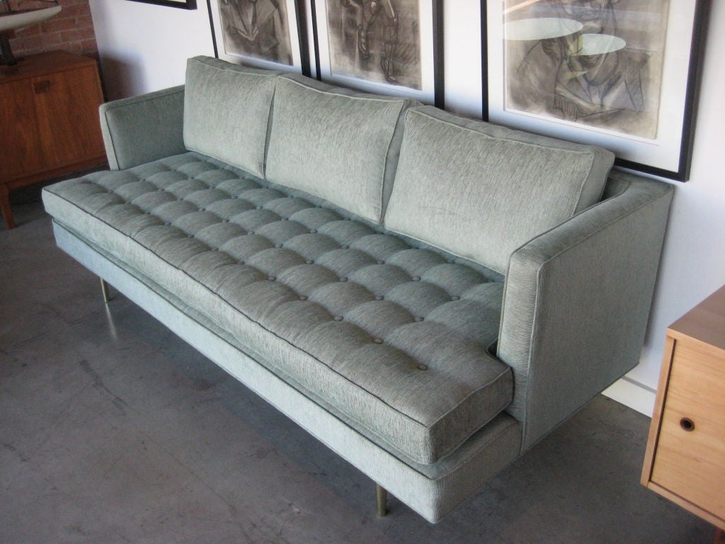 Mid-20th Century Dunbar sofa on polished brass legs