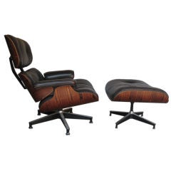 Rosewood 670 lounge chair and ottoman by Charles Eames