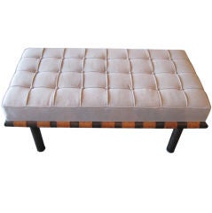 Bronze framed bench with distressed leather straps