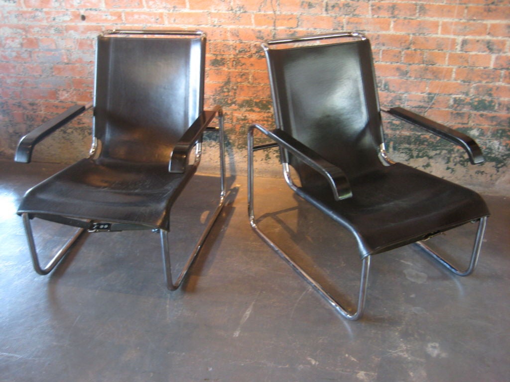 Pair of leather lounge chairs with beautiful patina.  Designed by Marcel Breuer and manufactured by Thonet.
