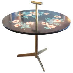 Brass table with flower motif by Piero Fornasetti