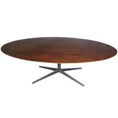 Large Rosewood and Bronze elliptical table by Florence Knoll