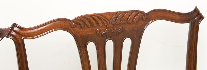 English Chippendale double chair-back settee with a carved crest<br />
shaped arms and molded straight legs
