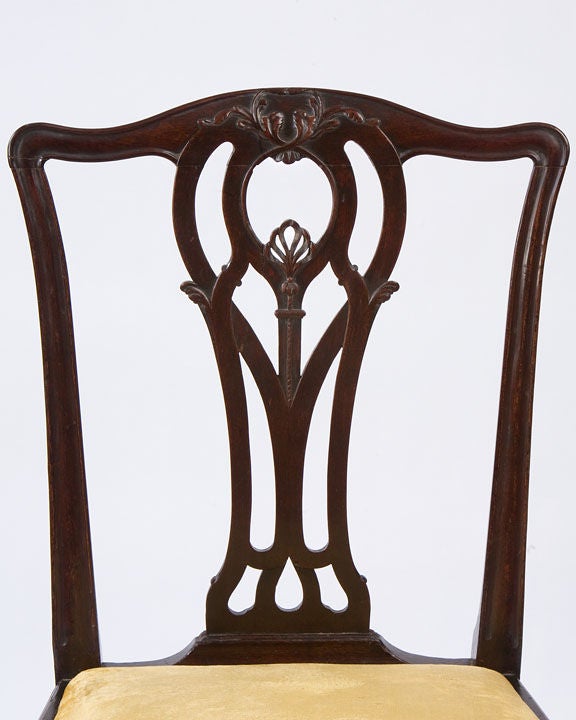 Fine pair of mahogany Chippendale side chairs with carved<br />
crest rails pierced backs, slip seats with straight legs