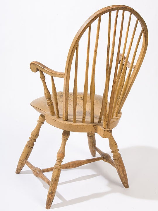 Well formed New England painted bow-back armchair with a <br />
saddle seat shaped arms with nicely turned legs