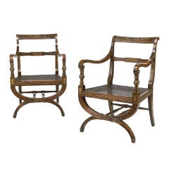A pair of English Regency curule form armchairs