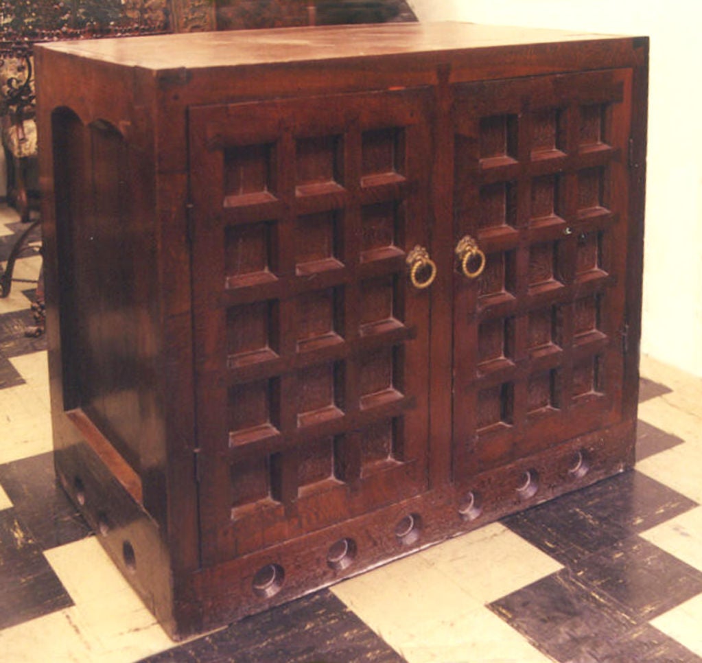 Strong, bold cabinet. Its massive geometric construction alluding to medieval designs. Interior with shelves and a vertical separation in the middle.
Our pieces are left in lived-in condition, pending our custom conservation and polish to