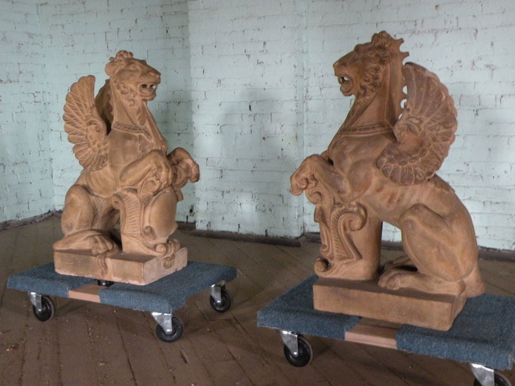 Baroque Revival Pair of 19th Century Terra Cotta Winged Lions For Sale