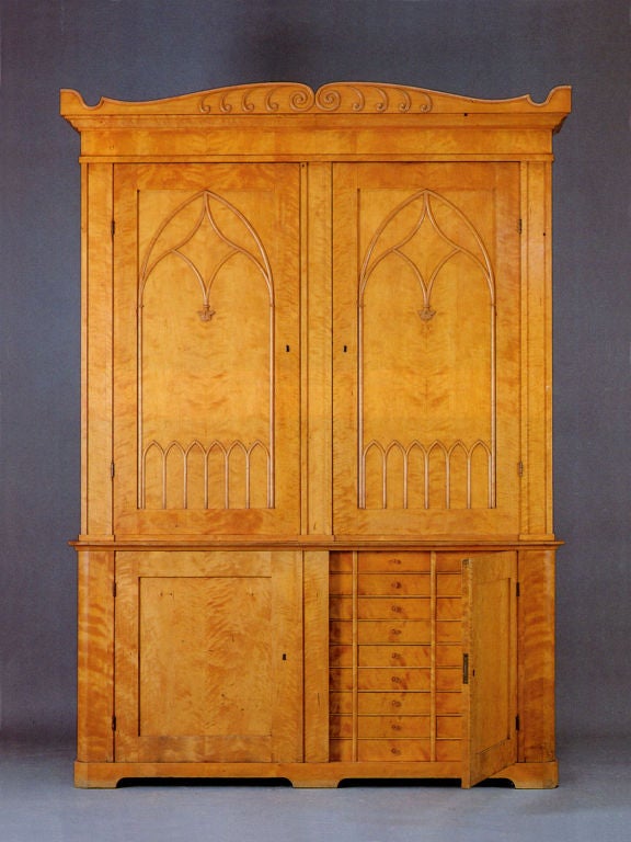 Imposing, large pair of bookcases, each in two parts, the tops with two doors revealing shelved interiors, the lower parts with two doors, one fitted with 45 drawers, the other fitted with shelves. Paper label inscribed ‘FAI 5’.