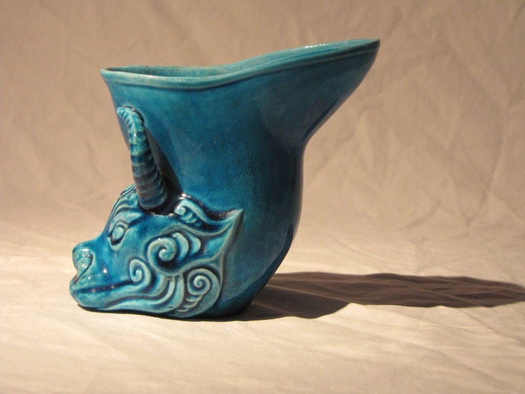 Chinese Peacock Blue, Porcelain , Bull's Head (Rhyton), Libation Cups, Qianlong Impressed Mark and of the Period.  <br />
This form borrows from the Greco-Roman and Scythian Rhyton Stirrup Cups, Usually Found in Cast Bronze and Precious Metals.