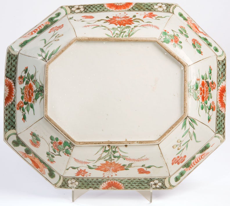 Chinese Porcelain Eight-Sided Basin Decorated in Famille Verte Overglaze Enamels Depicting Birds in a Pine Tree Surrounded by Chrysanthamums and Tree Peonies.  The Rim is Decorated with Alternating Cartouches Containing Insects and Textile Patterns.