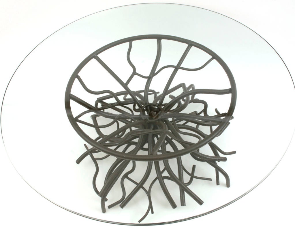 Sculptural formed metal cocktail table composed of twisted tubular rods of steel done in a bronze finish. This heavy duty organic flowing form will support quite a substantial glass top. Glass not included