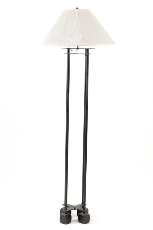 Important pair of Warren Mcarthur floor lamps designed for the Arizona Biltmore hotel in Phoenix in 1927.  These examples are done in tubular black iron with solid square iron bases neath each tubular rod. The shades were custom made to match the