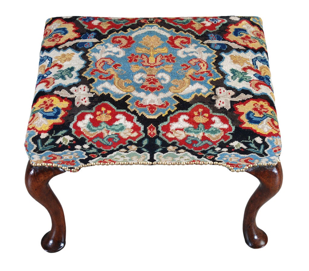 A Queen Anne period walnut stool on beautifully drawn cabriole legs ending in pad feet. Terrific color.