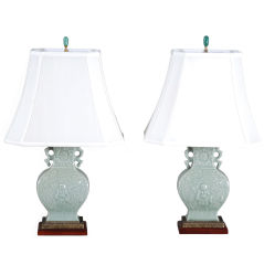 PAIR OF CELADON LAMPS WITH RAISED BUDDHA