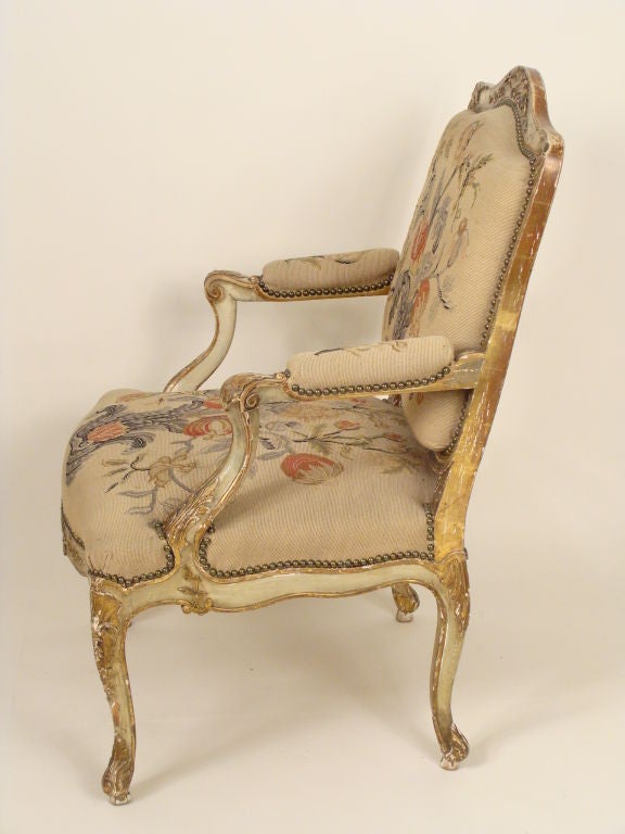 Pair of Louis XV painted and partial gilt armchairs