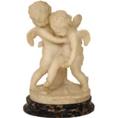 Pair of carved  alabaster cherubs