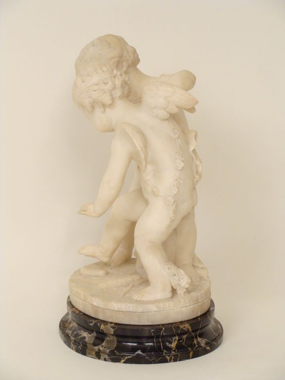 Pair of carved  alabaster cherubs