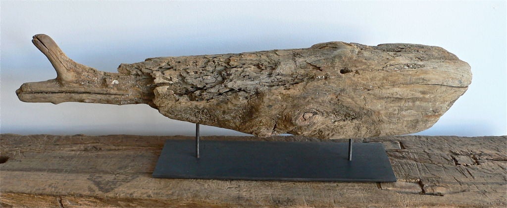 Folk Art whale carving mounted on iron base.
