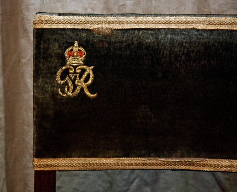 George the Sixth Coronation chair and stool from the coronation of George the Sixth, with royal insignia and crown. The chair would have been used by a guest of royal or noble blood while the stool would have been reserved for a guest of lower rank.