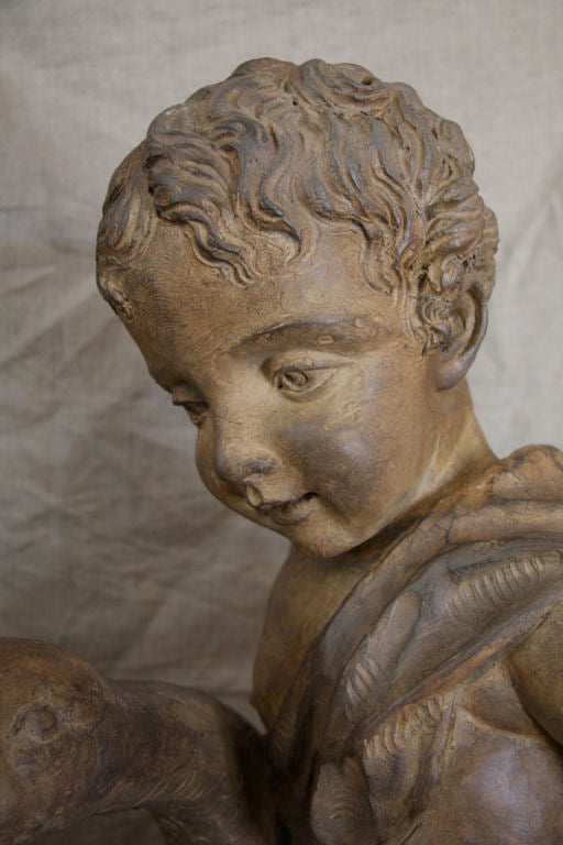 Large French Terracotta statue of a young boy on a goose